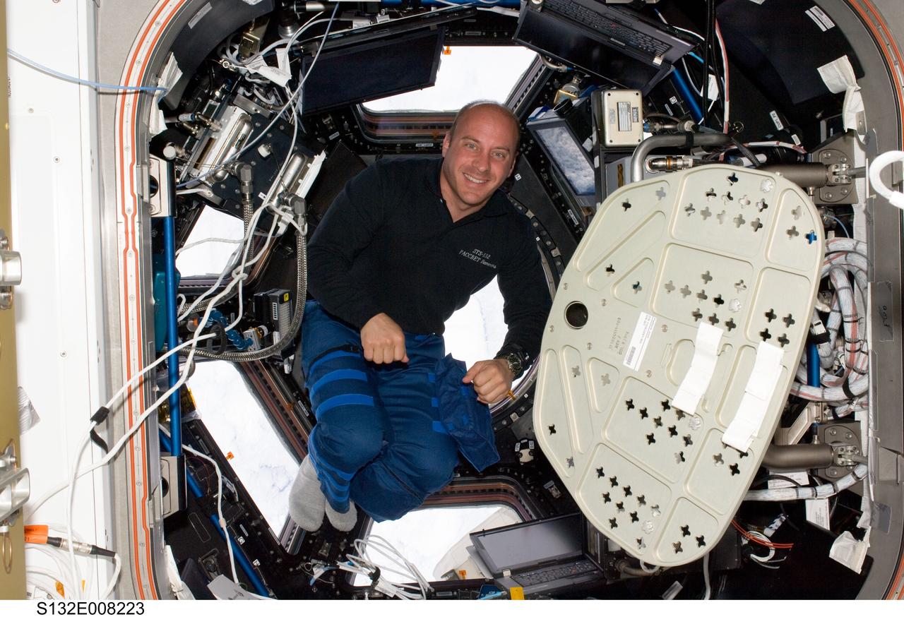 S132-E-008223 (19 May 2010) --- NASA astronaut Garrett Reisman, STS-132 mission specialist, is pictured in the Cupola of the International Space Station while space shuttle Atlantis remains docked with the station.