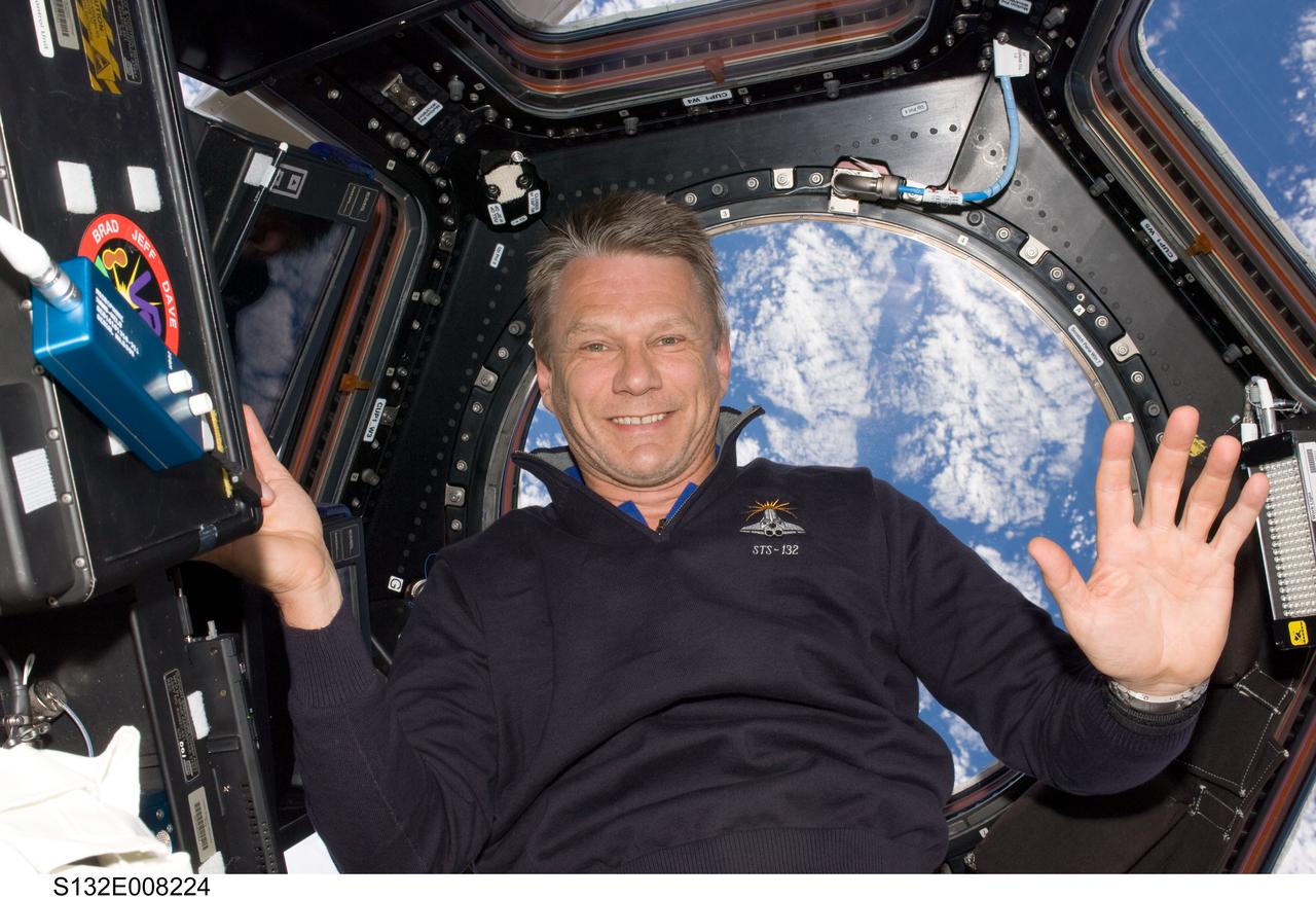 S132-E-008224 (19 May 2010) --- NASA astronaut Piers Sellers, STS-132 mission specialist, is pictured in the Cupola of the International Space Station while space shuttle Atlantis remains docked with the station.