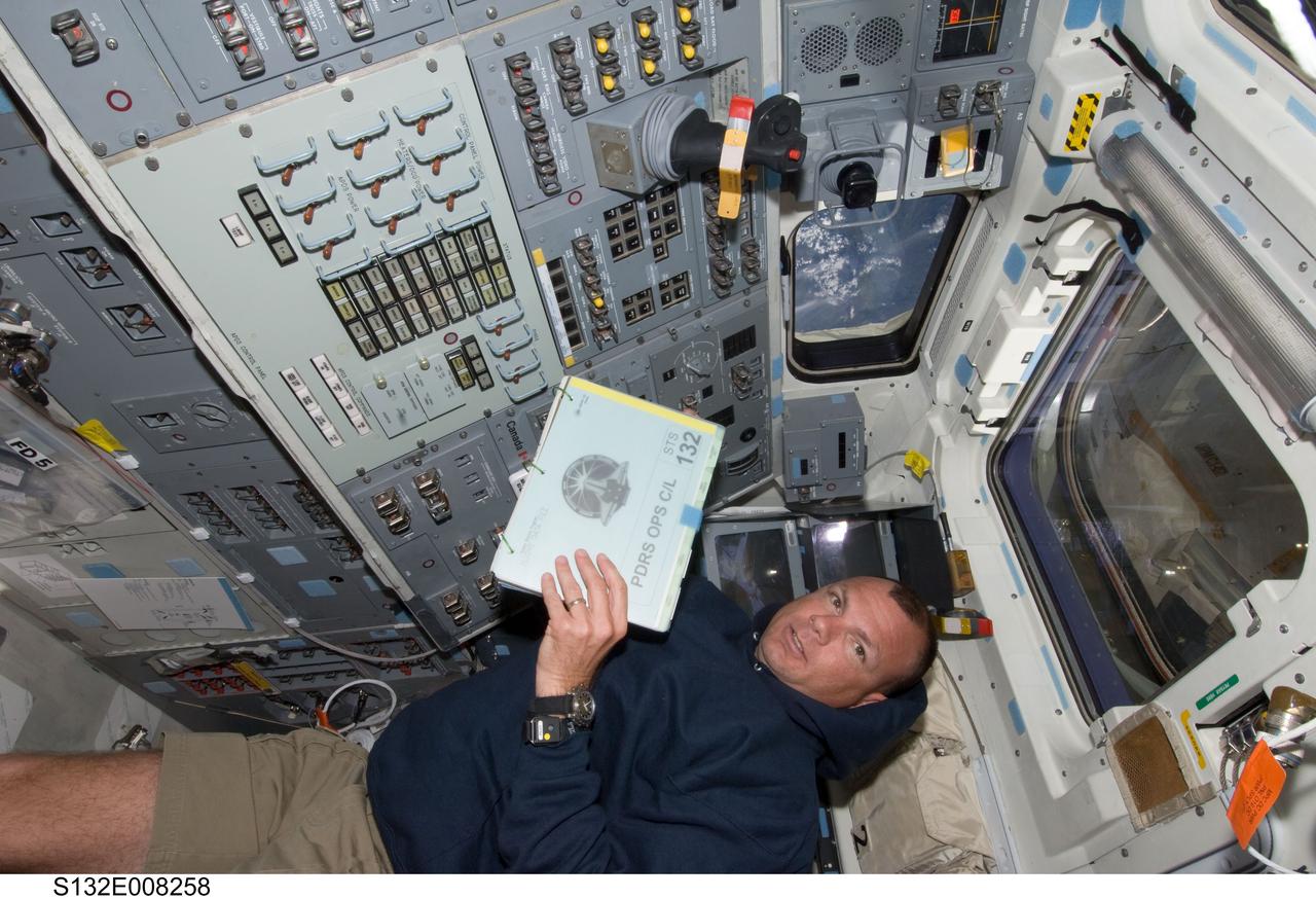 S132-E-008258 (18 May 2010) --- NASA astronaut Tony Antonelli, STS-132 pilot, is pictured on the aft flight deck of space shuttle Atlantis while docked with the International Space Station.