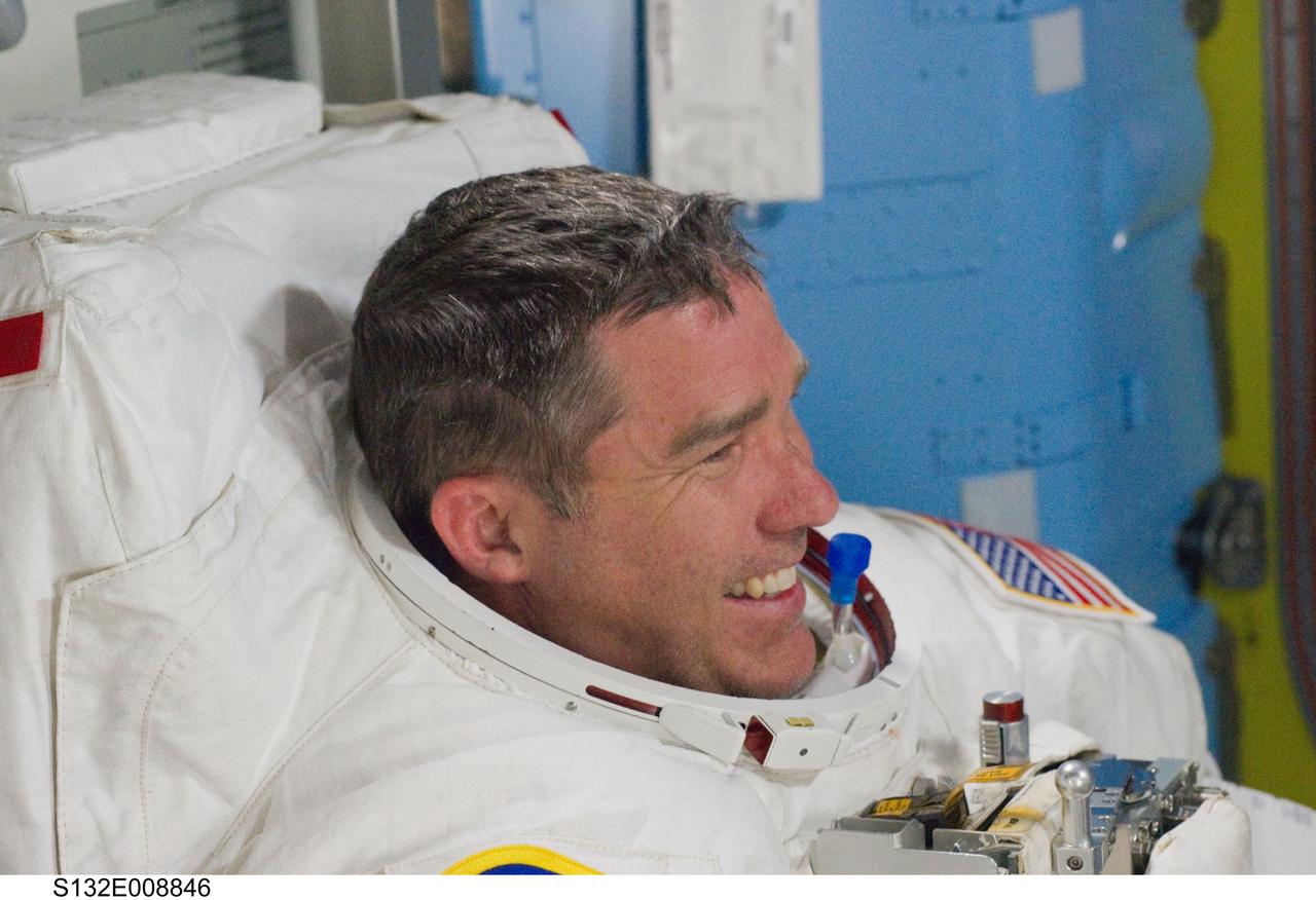 S132-E-008846 (19 May 2010) --- NASA astronaut Steve Bowen, STS-132 mission specialist, is pictured in the Quest airlock of the International Space Station as the mission’s second spacewalk draws to a close.