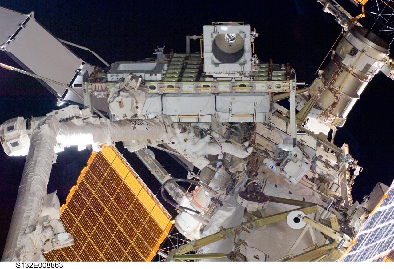 S132-E-008863 (21 May 2010) --- NASA astronauts Garrett Reisman (right) and Michael Good, both STS-132 mission specialists, participate in the mission’s third and final session of extravehicular activity (EVA) as construction and maintenance continue on the International Space Station. During the six-hour, 46-minute spacewalk, Good and Reisman completed the installation of the final two of the six new batteries for the B side of the port 6 solar array. In addition, the astronauts installed a backup ammonia jumper cable between the port 4 and 5 trusses of the station, transferred a Power and Data Grapple Fixture from the shuttle to the station, and reconfigured some tools.