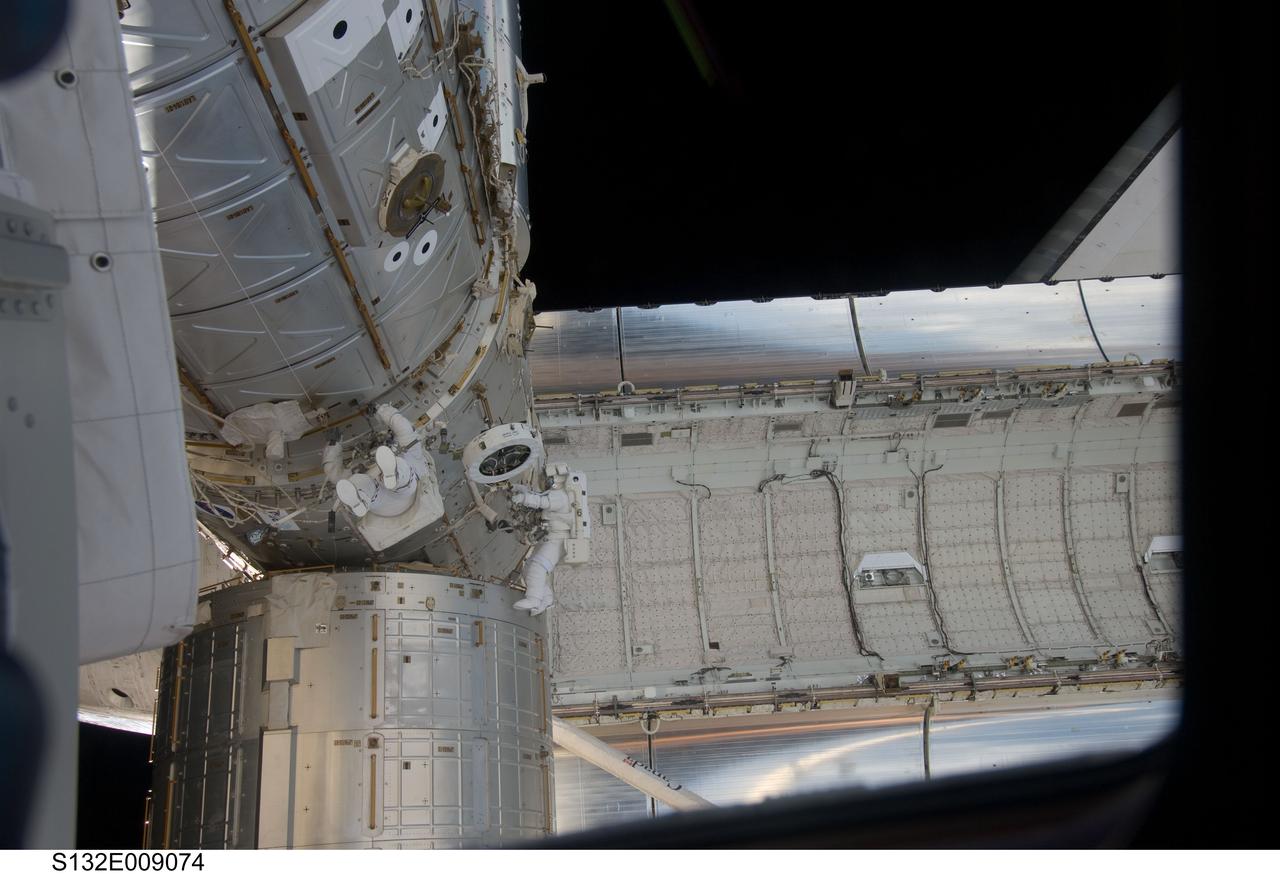 S132-E-009074 (21 May 2010) --- NASA astronauts Michael Good (left) and Garrett Reisman, both STS-132 mission specialists, participate in the mission’s third and final session of extravehicular activity (EVA) as construction and maintenance continue on the International Space Station. During the six-hour, 46-minute spacewalk, Good and Reisman completed the installation of the final two of the six new batteries for the B side of the port 6 solar array. In addition, the astronauts installed a backup ammonia jumper cable between the port 4 and 5 trusses of the station, transferred a Power and Data Grapple Fixture from the shuttle to the station, and reconfigured some tools.