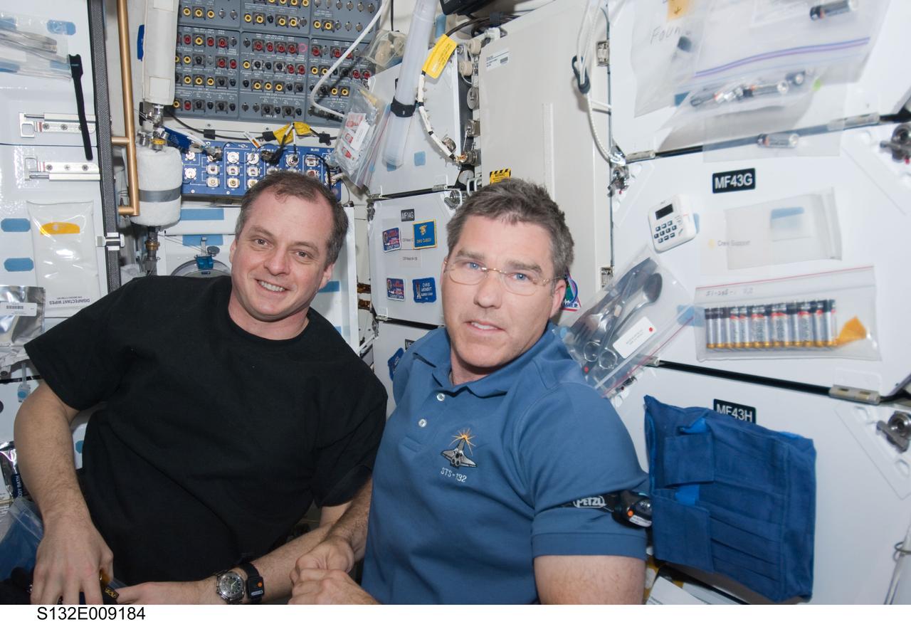 S132-E-009184 (22 May 2010) --- NASA astronauts T.J. Creamer (left), Expedition 23 flight engineer, and Steve Bowen, STS-132 mission specialist, are on the mid deck of the space shuttle Atlantis, which is currently docked to the International Space Station. This Atlantis visit represents relatively new surroundings to Creamer, who is in the latter stages of a long duration stay aboard the orbital outpost. For approximately a week now, the station has hosted an aggregate of twelve astronauts and cosmonauts who have joined efforts in working on completion of the station. Photo credit: NASA or National Aeronautics and Space Administration