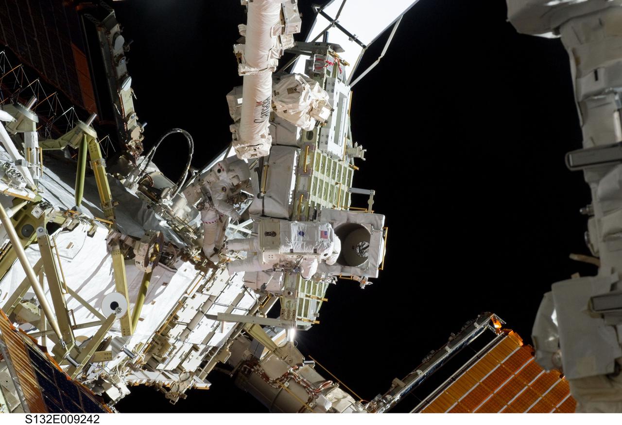 S132-E-009242 (21 May 2010) --- NASA astronauts Michael Good (left) and Garrett Reisman, both STS-132 mission specialists, participate in the mission’s third and final session of extravehicular activity (EVA) as construction and maintenance continue on the International Space Station. During the six-hour, 46-minute spacewalk, Good and Reisman completed the installation of the final two of the six new batteries for the B side of the port 6 solar array. In addition, the astronauts installed a backup ammonia jumper cable between the port 4 and 5 trusses of the station, transferred a Power and Data Grapple Fixture from the shuttle to the station, and reconfigured some tools.