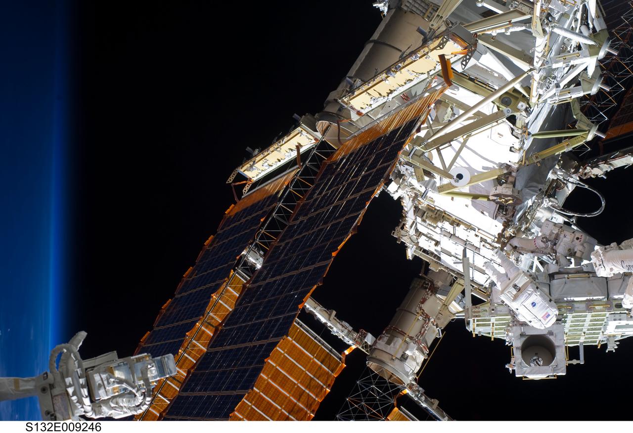 S132-E-009246 (21 May 2010) --- NASA astronauts Michael Good and Garrett Reisman, both STS-132 mission specialists, participate in the mission’s third and final session of extravehicular activity (EVA) as construction and maintenance continue on the International Space Station. During the six-hour, 46-minute spacewalk, Good and Reisman completed the installation of the final two of the six new batteries for the B side of the port 6 solar array. In addition, the astronauts installed a backup ammonia jumper cable between the port 4 and 5 trusses of the station, transferred a Power and Data Grapple Fixture from the shuttle to the station, and reconfigured some tools.