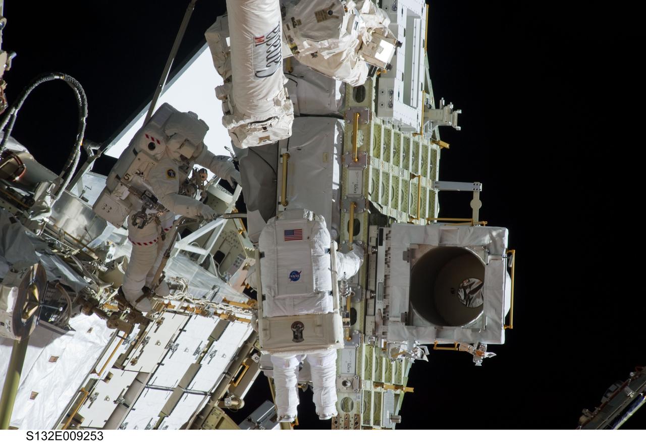 S132-E-009253 (21 May 2010) --- NASA astronauts Michael Good (left) and Garrett Reisman, both STS-132 mission specialists, participate in the mission’s third and final session of extravehicular activity (EVA) as construction and maintenance continue on the International Space Station. During the six-hour, 46-minute spacewalk, Good and Reisman completed the installation of the final two of the six new batteries for the B side of the port 6 solar array. In addition, the astronauts installed a backup ammonia jumper cable between the port 4 and 5 trusses of the station, transferred a Power and Data Grapple Fixture from the shuttle to the station, and reconfigured some tools.