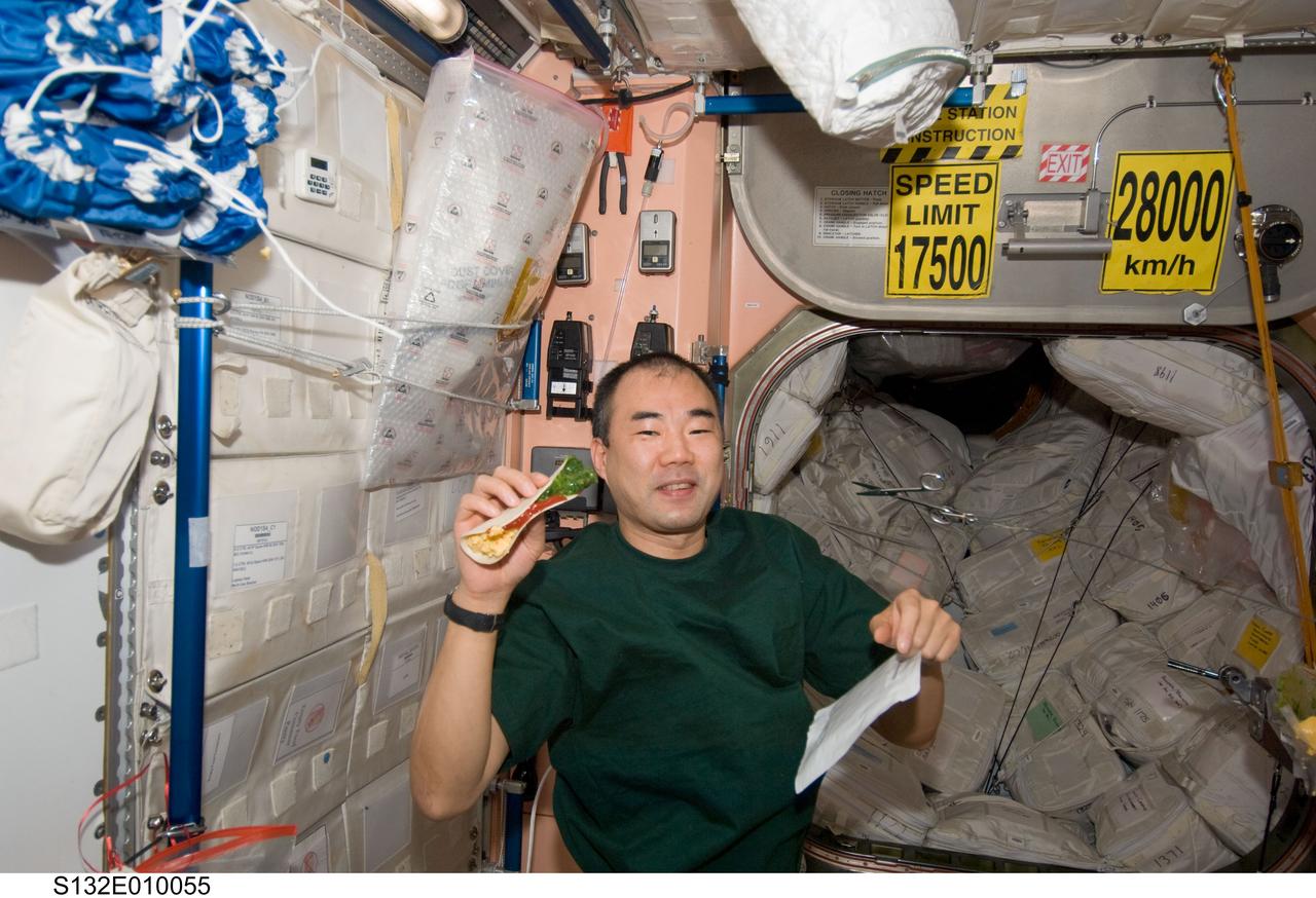 Noguchi holds taco in the Node 1 during Joint Operations