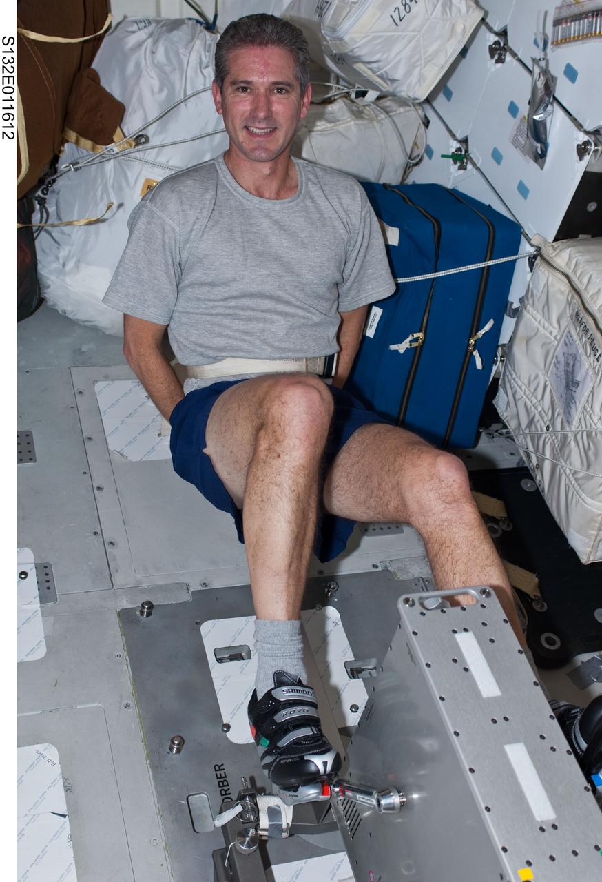 S132-E-011612 (24 May 2010) --- NASA astronaut Michael Good, STS-132 mission specialist, exercises on a bicycle ergometer on the middeck of space shuttle Atlantis during flight day 11 activities.