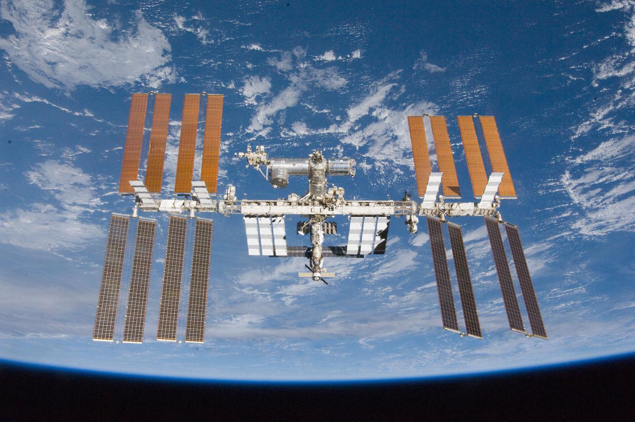 S132-E-012212 (23 May 2010) --- The International Space Station is featured in this image photographed by an STS-132 crew member on space shuttle Atlantis after the station and shuttle began their post-undocking relative separation. Undocking of the two spacecraft occurred at 10:22 a.m. (CDT) on May 23, 2010, ending a seven-day stay that saw the addition of a new station module, replacement of batteries and resupply of the orbiting outpost.