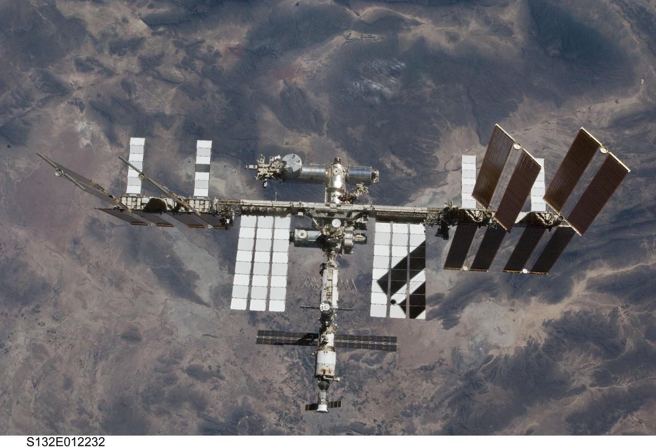 S132-E-012232 (23 May 2010) --- The International Space Station is featured in this image photographed by an STS-132 crew member on space shuttle Atlantis after the station and shuttle began their post-undocking relative separation. Undocking of the two spacecraft occurred at 10:22 a.m. (CDT) on May 23, 2010, ending a seven-day stay that saw the addition of a new station module, replacement of batteries and resupply of the orbiting outpost.