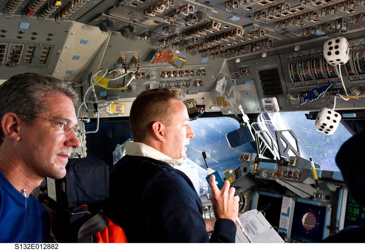 S132-E-012882 (26 May 2010) --- NASA astronauts Ken Ham (right), STS-132 commander, and Michael Good, mission specialist, are pictured on the flight deck of space shuttle Atlantis as the crew prepares for landing at NASA?s Kennedy Space Center, Florida.