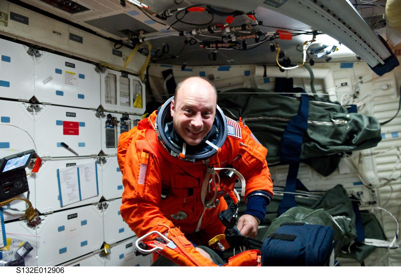 S132-E-012906 (26 May 2010) --- Attired in his shuttle launch and entry suit, NASA astronaut Garrett Reisman, STS-132 mission specialist, is pictured on the middeck of space shuttle Atlantis as the crew prepares for landing at NASA’s Kennedy Space Center, Florida.