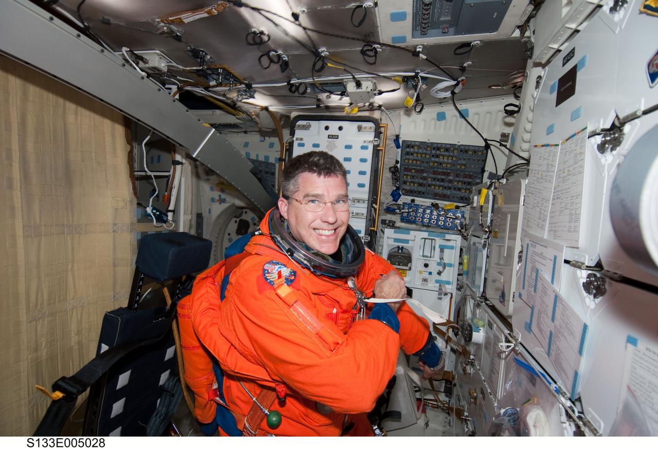 S133-E-005028 (24 Feb. 2011) --- Astronaut Steve Bowen, STS-133 mission specialist, is seen on the middeck of the space shuttle Discovery soon after reaching Earth orbit on flight day one. Bowen is still in his launch and entry escape suit. Photo credit: NASA or National Aeronautics and Space Administration