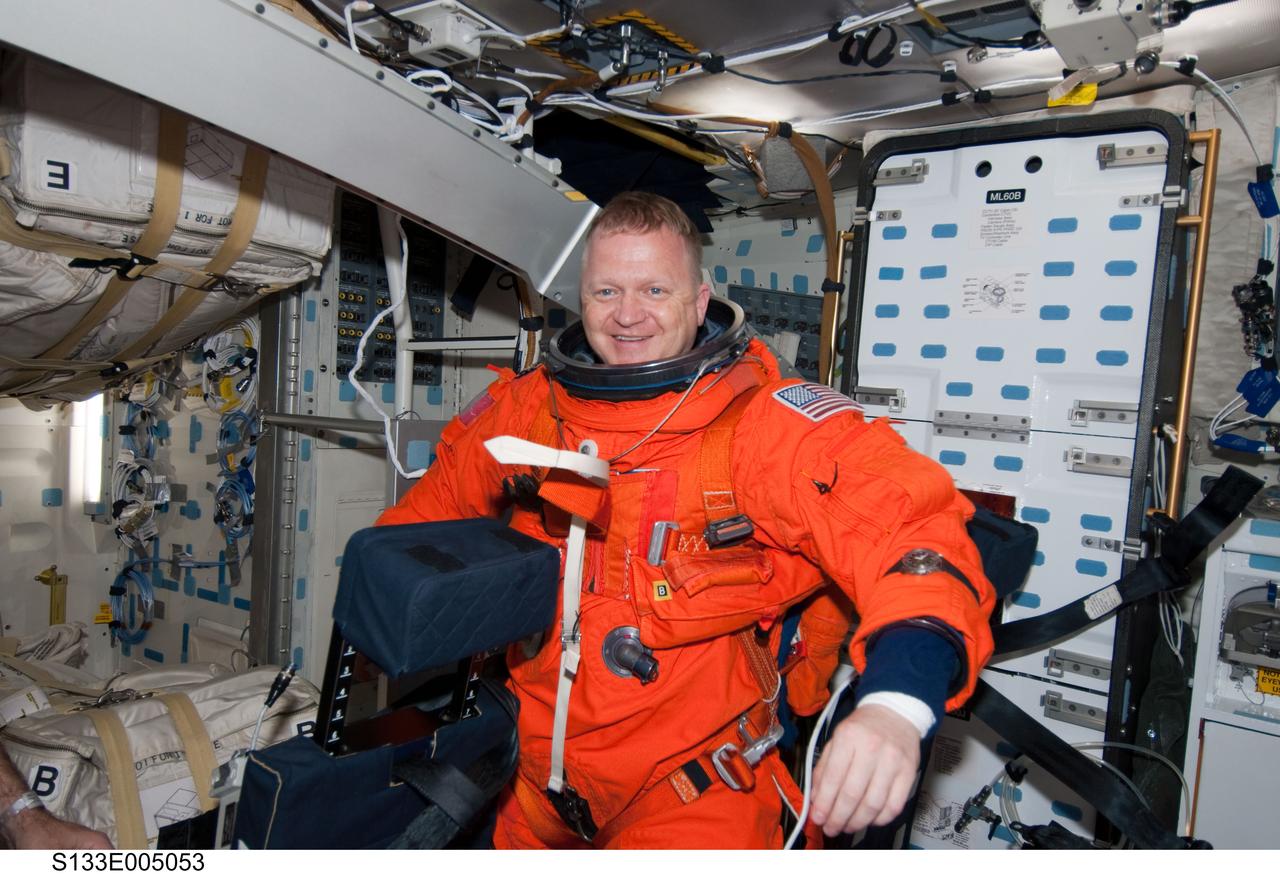 S133-E-005053 (24 Feb. 2011) --- Astronaut Eric Boe, STS-133 pilot, is seen on the middeck of the space shuttle Discovery soon after reaching Earth orbit on flight day one. Boe is still in his launch and entry escape suit. Photo credit: NASA or National Aeronautics and Space Administration