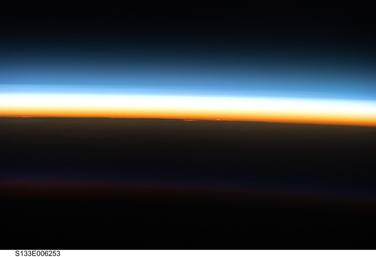 S133-E-006253 (25 Feb. 2011) --- Layers of Earth's atmosphere, brightly colored as the sun rises, are featured in this image photographed by an STS-133 crew member on the Earth-orbiting space shuttle Discovery during flight day two activities. Photo credit: NASA or National Aeronautics and Space Administration