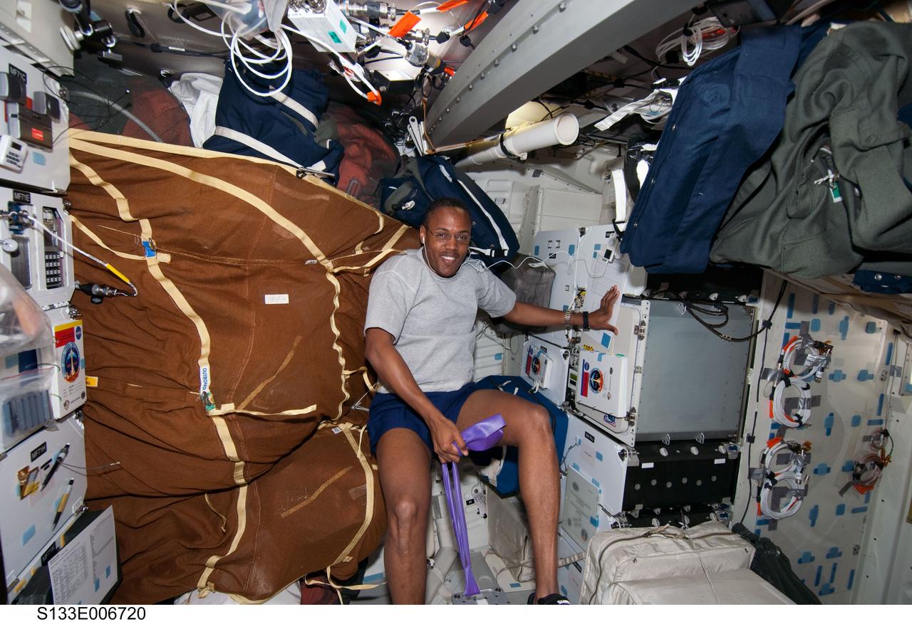 S133-E-006720 (26 Feb. 2011) --- NASA astronaut Alvin Drew, STS-133 mission specialist, is pictured on the middeck of space shuttle Discovery during flight day three activities. Photo credit: NASA or National Aeronautics and Space Administration
