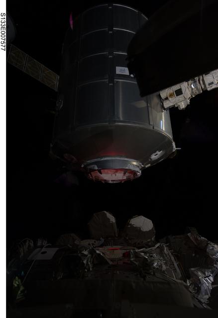 NASA image: Dark view of PMM being transferred to Node 1