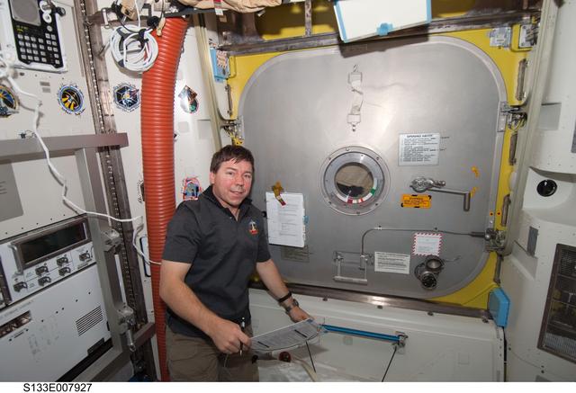 NASA image: STS-133 and Expedition 26 crew enter PMM (Permanent Multipurpose Module)