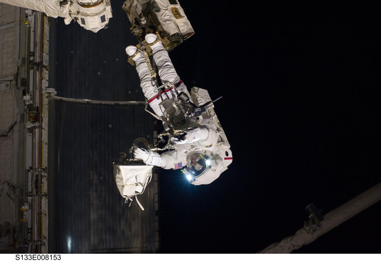S133-E-008153 (2 March 2011) --- Anchored to a Canadarm2 mobile foot restraint, NASA astronaut Steve Bowen, STS-133 mission specialist, participates in the mission’s second session of extravehicular activity (EVA) as construction and maintenance continue on the International Space Station. During the six-hour, 14-minute spacewalk, Bowen and astronaut Alvin Drew (out of frame), mission specialist, tackled a variety of tasks, including venting into space some remaining ammonia from a failed pump module they moved during the mission’s first spacewalk. Photo credit: NASA or National Aeronautics and Space Administration