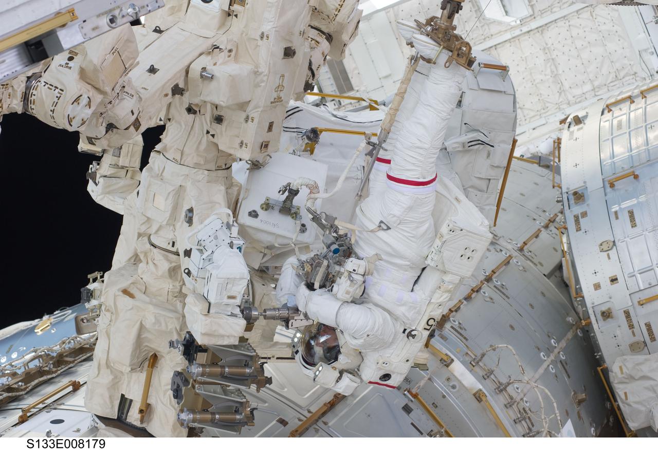S133-E-008179 (2 March 2011) --- Anchored to a Canadarm2 mobile foot restraint, NASA astronaut Steve Bowen, STS-133 mission specialist, participates in the mission’s second session of extravehicular activity (EVA) as construction and maintenance continue on the International Space Station. During the six-hour, 14-minute spacewalk, Bowen and astronaut Alvin Drew (out of frame), mission specialist, tackled a variety of tasks, including venting into space some remaining ammonia from a failed pump module they moved during the mission’s first spacewalk. Photo credit: NASA or National Aeronautics and Space Administration