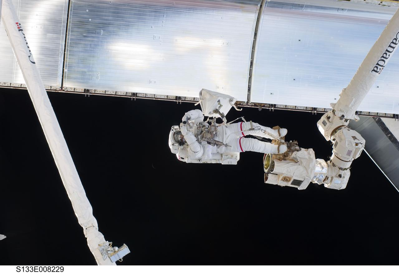 S133-E-008229 (2 March 2011) --- Anchored to a Canadarm2 mobile foot restraint, NASA astronaut Steve Bowen, STS-133 mission specialist, participates in the mission’s second session of extravehicular activity (EVA) as construction and maintenance continue on the International Space Station. During the six-hour, 14-minute spacewalk, Bowen and astronaut Alvin Drew (out of frame), mission specialist, tackled a variety of tasks, including venting into space some remaining ammonia from a failed pump module they moved during the mission’s first spacewalk. Photo credit: NASA or National Aeronautics and Space Administration