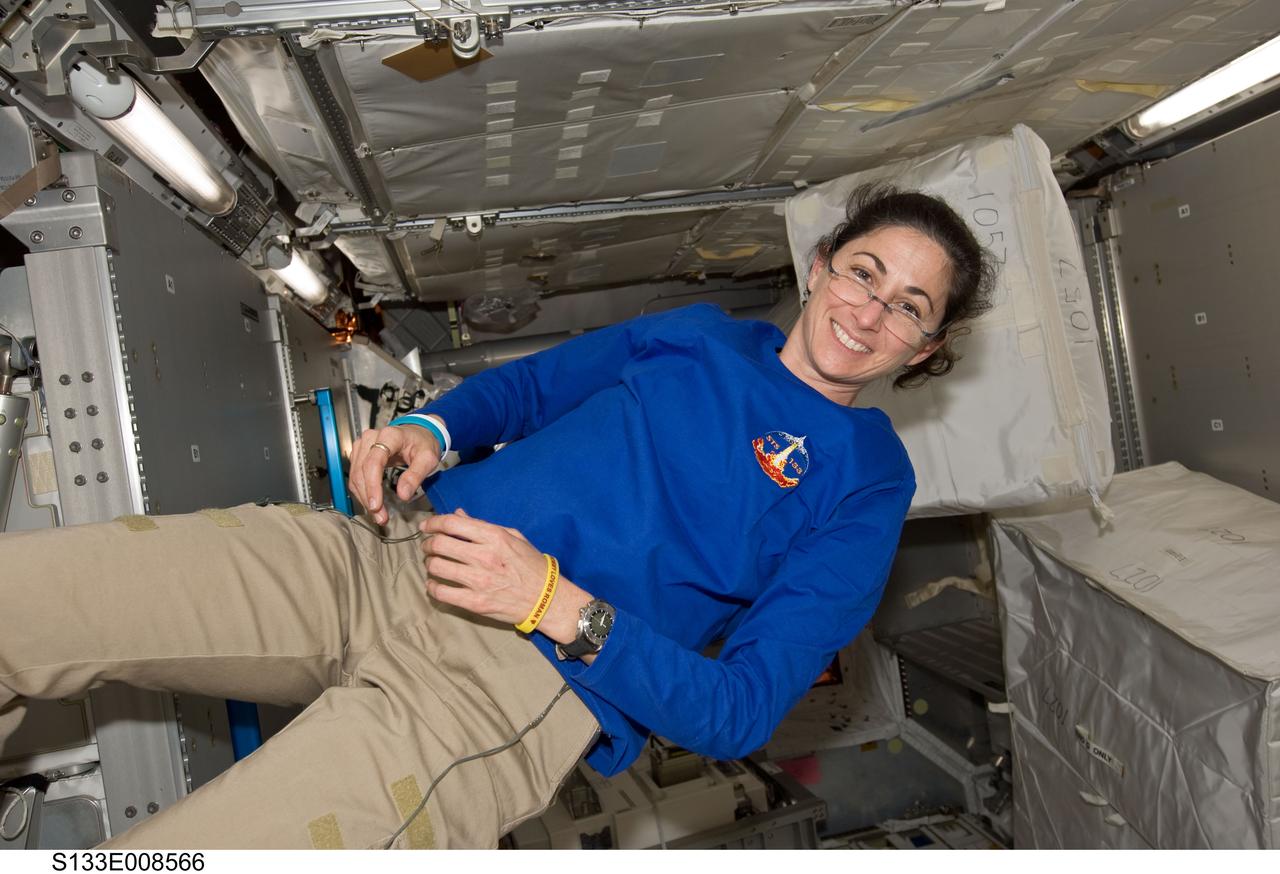 S133-E-008566 (4 March 2011) --- NASA astronaut Nicole Stott, STS-133 mission specialist, takes a pause during another moving day onboard the International Space Station as she participates in the team effort of 12 total astronauts and cosmonauts working together temporarily onboard the orbital outpost. The joint crews added the pictured Permanent Multipurpose Module (PMM) to the station earlier in the week. Photo credit: NASA or National Aeronautics and Space Administration