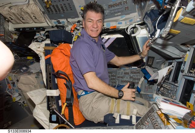 NASA image: Nespoli on Discovery forward flight deck.