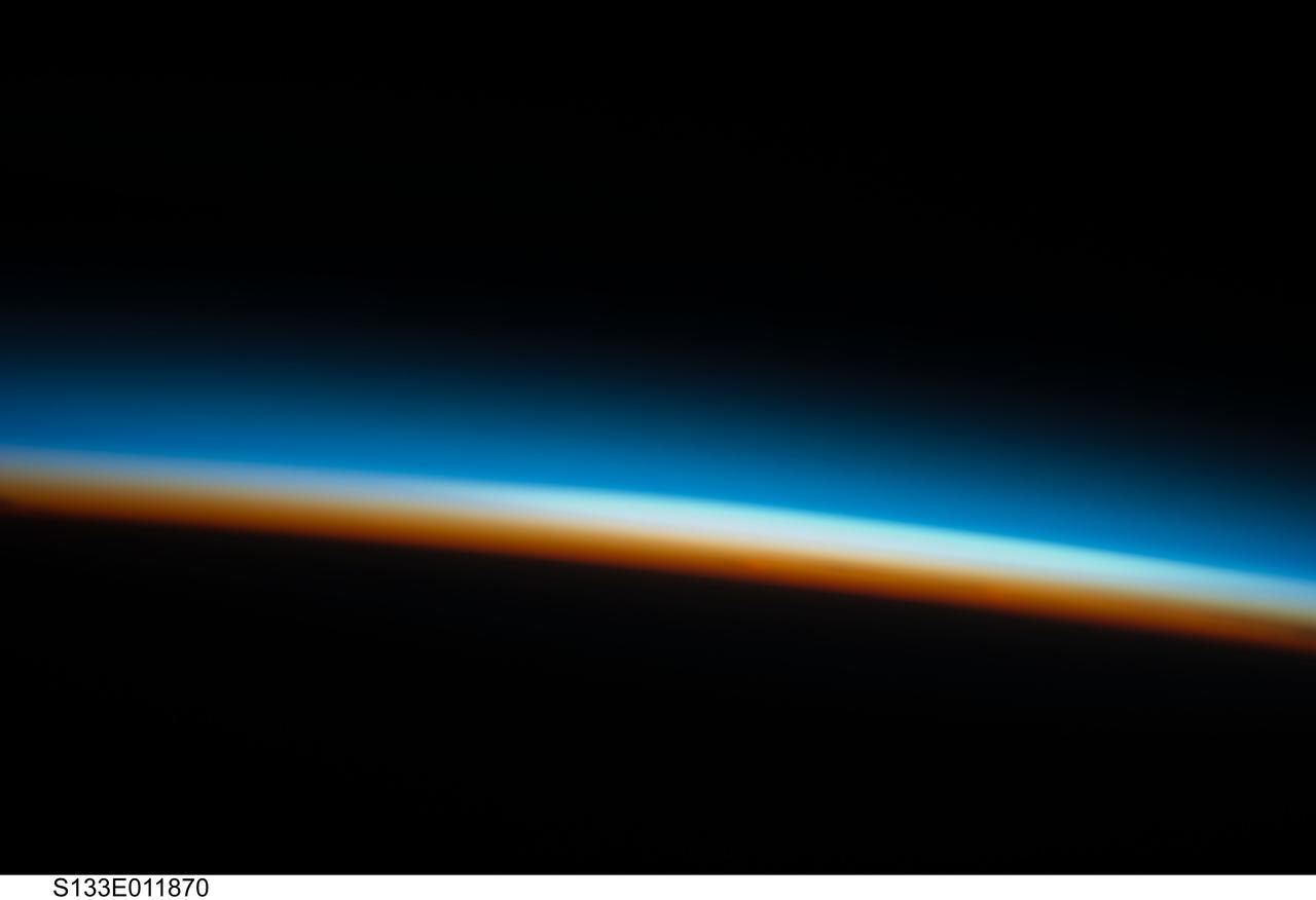 S133-E-011870 (7 March 2011) --- Layers of Earth's atmosphere, brightly colored as the sun rises, are featured in this image photographed by an STS-133 crew member on space shuttle Discovery during flight day 12 activities. Photo credit: NASA or National Aeronautics and Space Administration