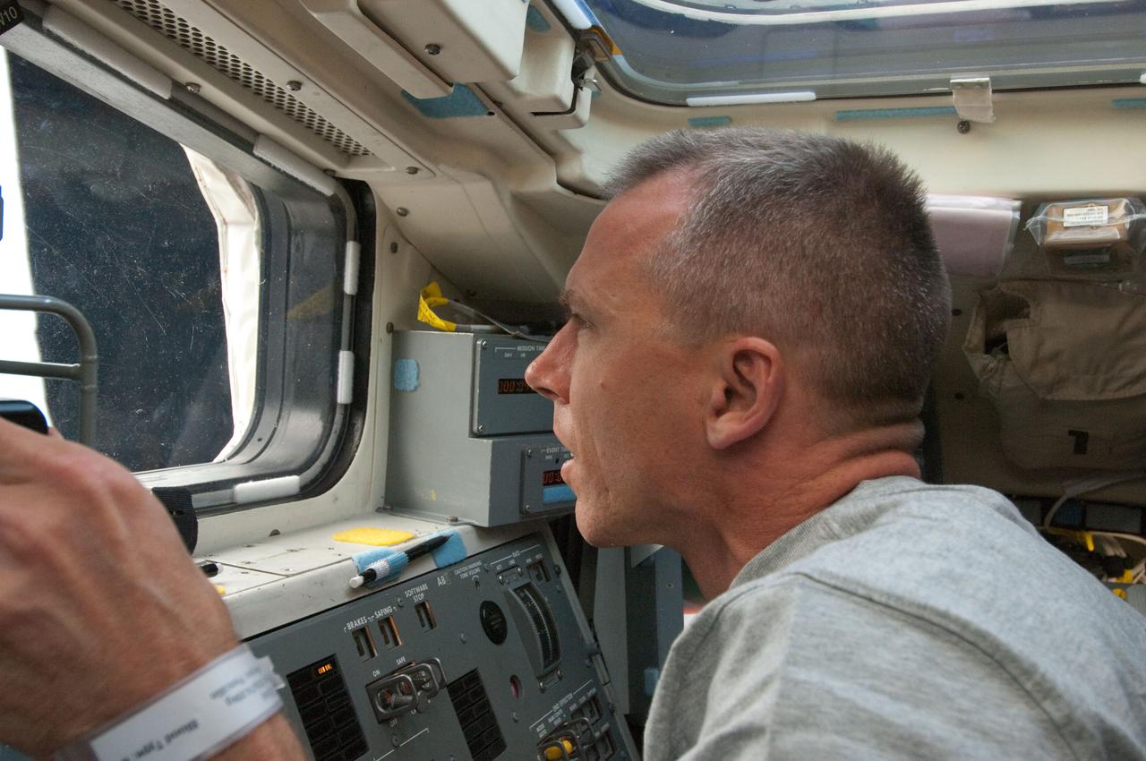 S134-E-005333 (16 May 2011) --- Astronaut Andrew Feustel, STS-134 mission specialist, looks out a window on the aft flight deck of space shuttle Endeavour's crew cabin soon after the vehicle reached Earth orbit for its last flight. Photo credit: NASA