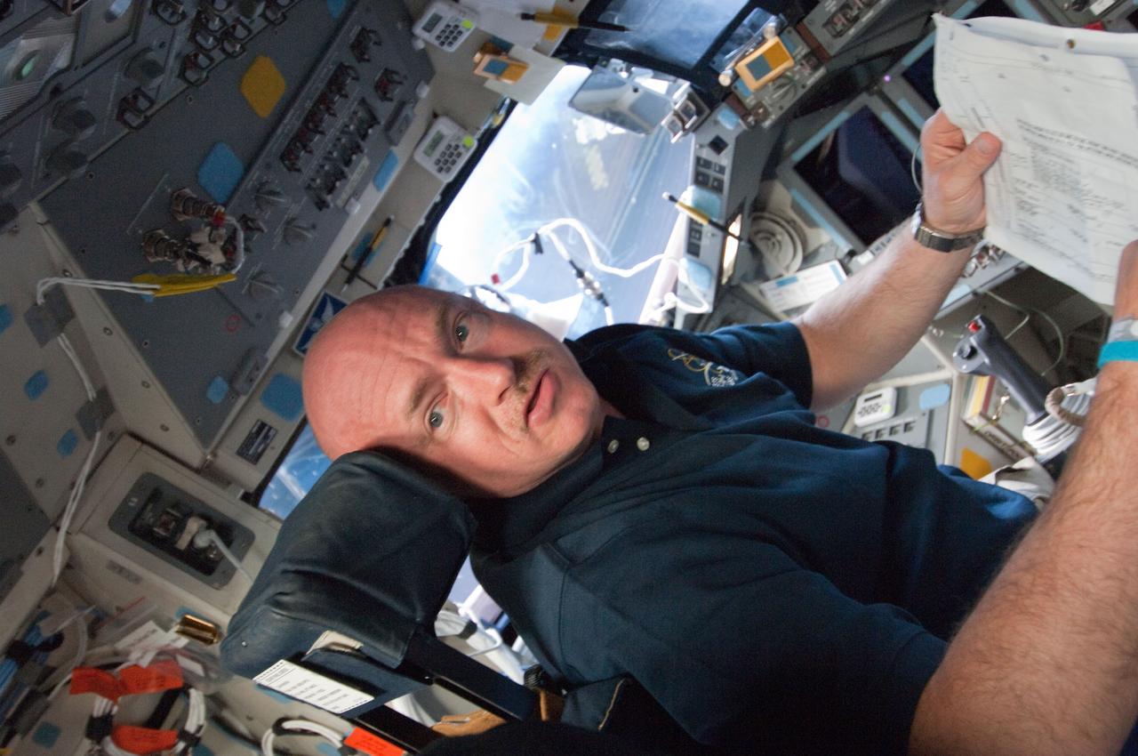 S134-E-005608 (16 May 2011) --- Astronaut Mark Kelly, STS-134 commander, gets down to work soon after Endeavour reaches Earth orbit. Kelly is seated at the commander's station on the shuttle's forward flight deck. Five other veteran crew members are joining the commander on a 16-day mission, much of which will be devoted to work on the International Space Station.  Photo credit: NASA