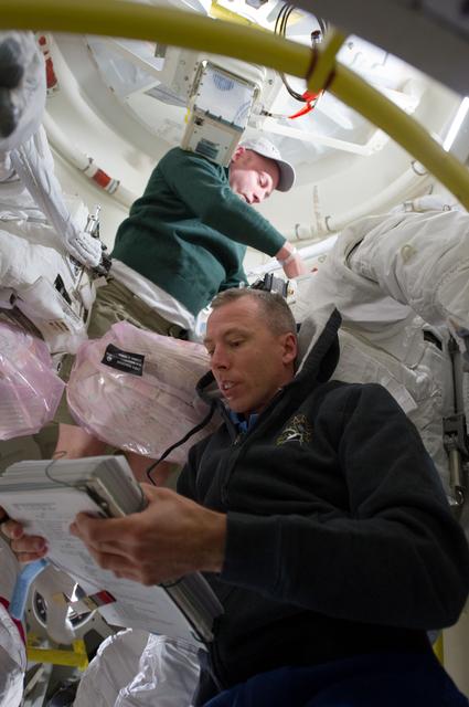 NASA image: View of STS-134 Crew Members working on the Middeck