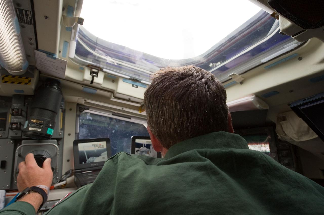 S134-E-006530 (17 May 2011) --- European Space Agency astronaut Roberto Vittori, STS-134 mission specialist, seen here at controls on Endeavour's aft flight deck, interfaces with the external/remote systems which, as well as performing other chores, work together to inspect the shuttle for possible damage. Vittori is  joining five other veteran astronauts for a 16-day mission -- Endeavour's farewell flight -- in Earth orbit. Docking with the International Space Station was only a day away at the time this picture was recorded. Photo credit: NASA