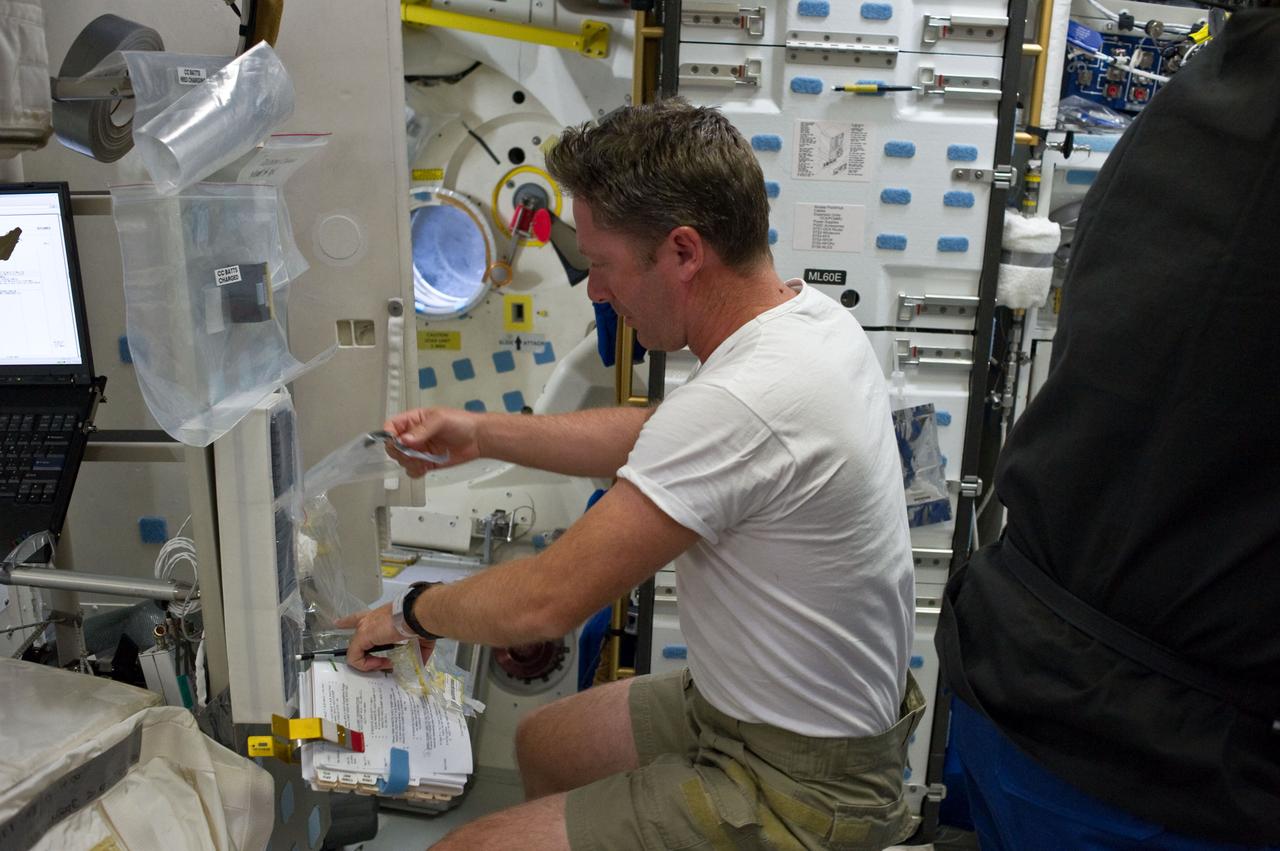 S134-E-007010 (18 May 2011) --- European Space Agency astronaut Roberto Vittori, STS-134 mission specialist, works on the middeck of space shuttle Endeavour during flight day three activities. Photo credit: NASA