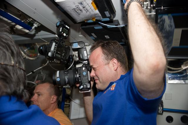 NASA image: STS-134 and Expedition 27 Crew Members greet one another after Docking