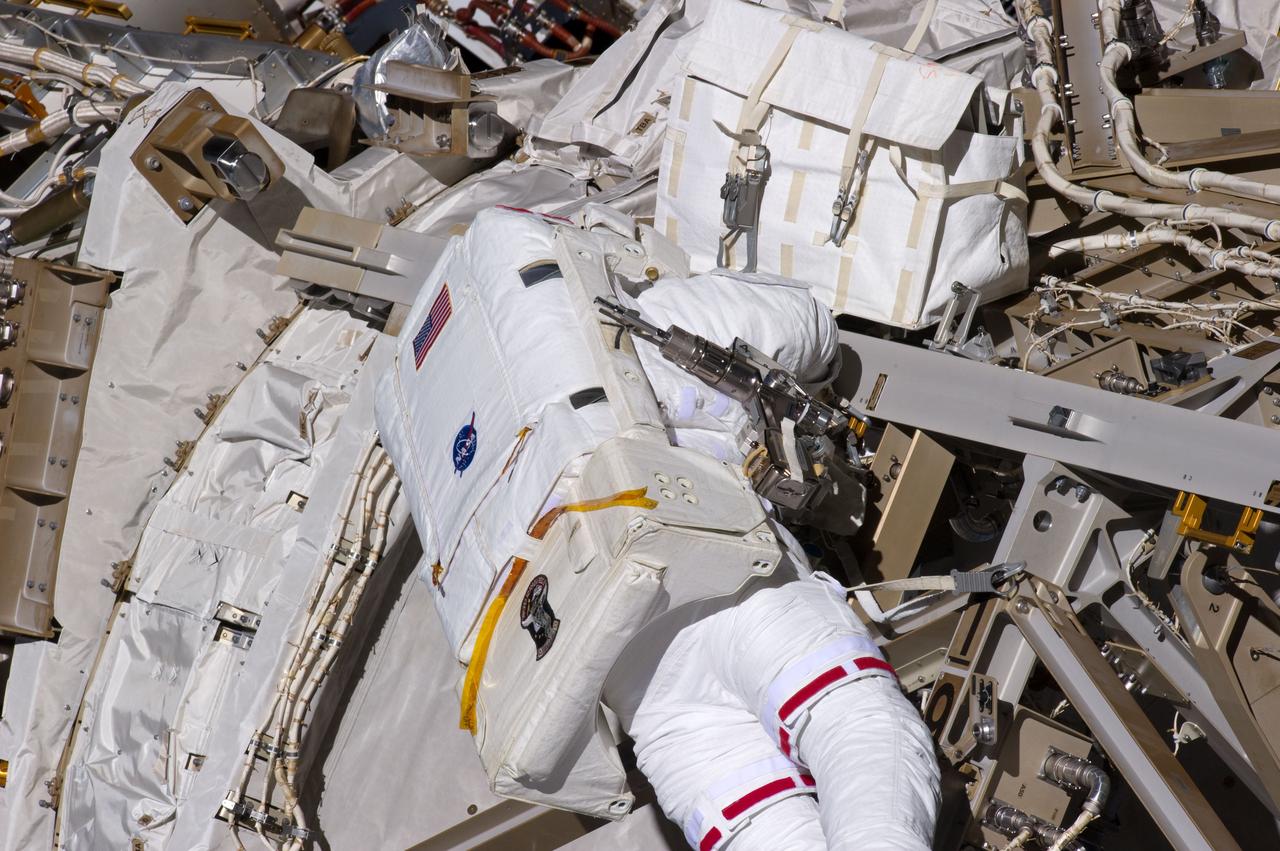 S134-E-007575 (20 May 2011) --- NASA astronaut Greg Chamitoff, STS-134 mission specialist, participates in the mission's first session of extravehicular activity (EVA) as construction and maintenance continue on the International Space Station. During the six-hour, 19-minute spacewalk, Chamitoff and astronaut Andrew Feustel (out of fame) retrieved long-duration materials exposure experiments and installed another, installed a light on one of the station?s rail line handcarts, made preparations for adding ammonia to a cooling loop and installed an antenna for the External Wireless Communication system. Photo credit: NASA