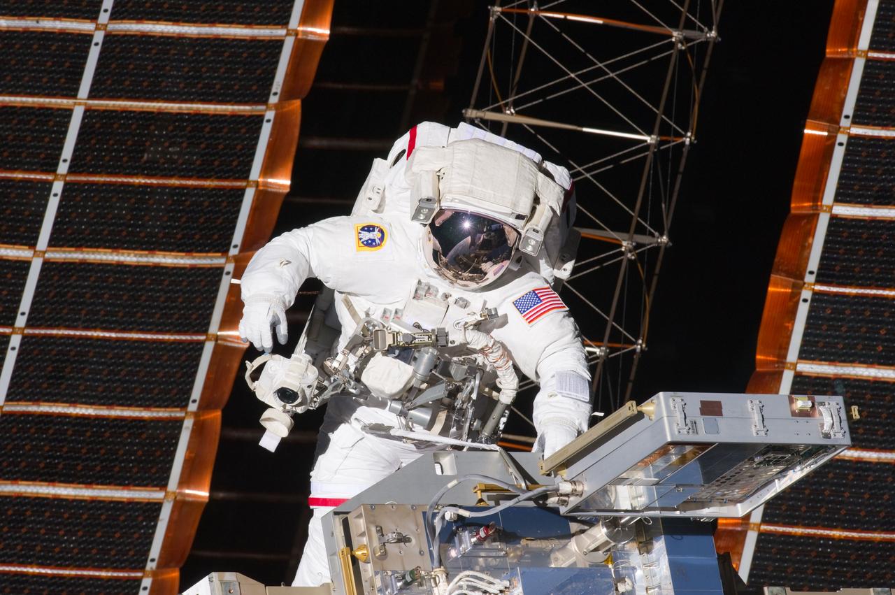 s134e007603 (5/20/2011) --- View of STS-134 Mission Specialist (MS-3) Andrew Feustel working to install a new Materials International Space Station Experiment (MISSE) on the EXPRESS (Expedite the Processing of Experiments to Space Station) Logistics Carrier 2 (ELC2) during the first session of Extravehicular Activity (EVA-1).