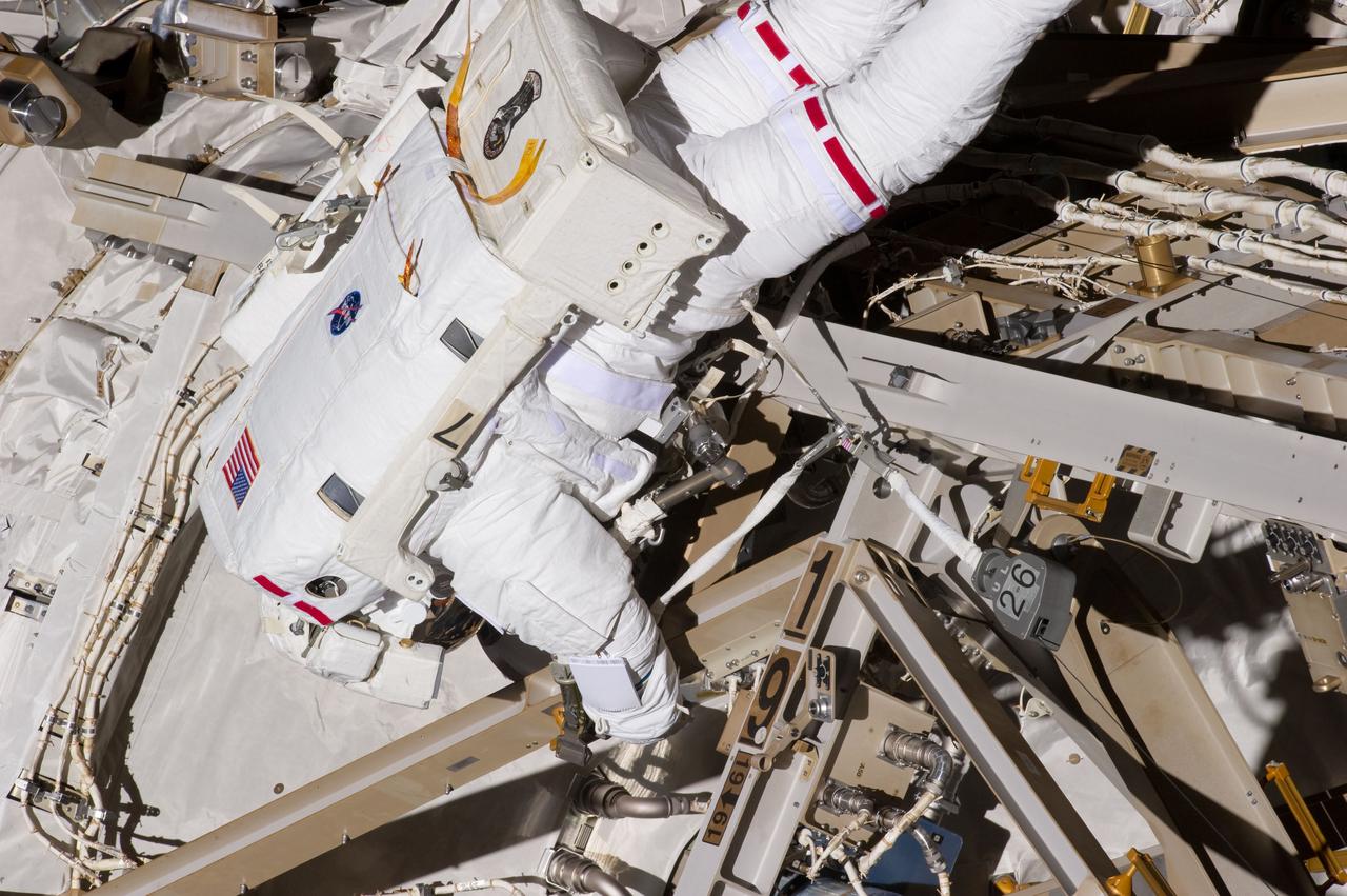 S134-E-007631 (20 May 2011) --- NASA astronaut Greg Chamitoff, STS-134 mission specialist, participates in the mission's first session of extravehicular activity (EVA) as construction and maintenance continue on the International Space Station. During the six-hour, 19-minute spacewalk, Chamitoff and astronaut Andrew Feustel (out of fame) retrieved long-duration materials exposure experiments and installed another, installed a light on one of the station?s rail line handcarts, made preparations for adding ammonia to a cooling loop and installed an antenna for the External Wireless Communication system. Photo credit: NASA