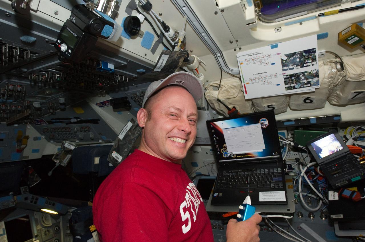 S134-E-007774 (20 May 2011) --- NASA astronaut Michael Fincke, STS-134 mission specialist, is pictured on the aft flight deck of space shuttle Endeavour while docked with the International Space Station. Photo credit: NASA