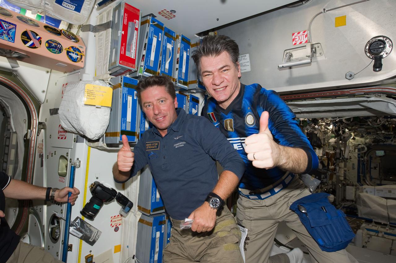 S134-E-008358 (21 May 2011) --- European Space Agency astronauts Paolo Nespoli (right), Expedition 27 flight engineer, and Roberto Vittori, STS-134 mission specialist, are pictured  onboard the International Space Station while space shuttle Endeavour remains docked with the station. Photo credit: NASA