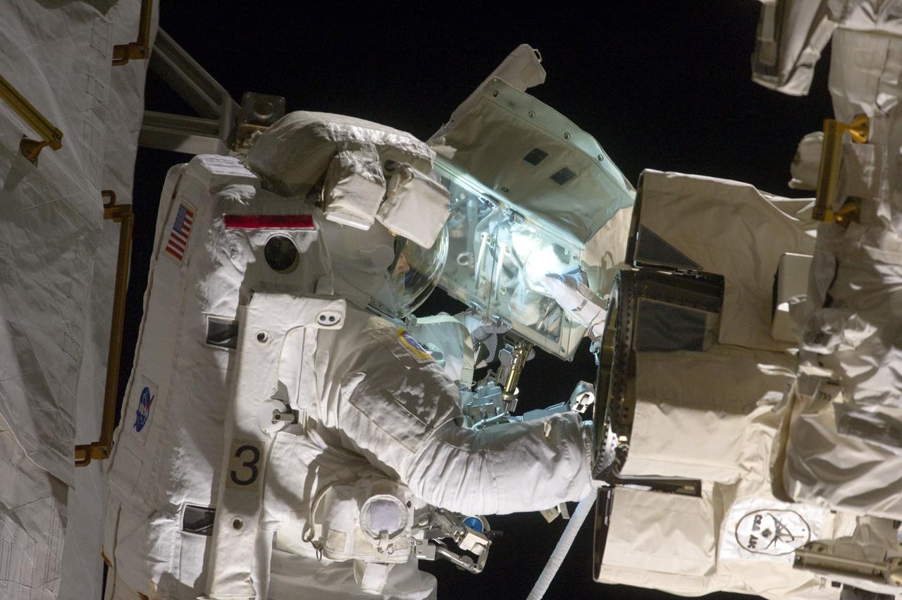 S134-E-008620 (22 May 2011) --- NASA astronaut Andrew Feustel, STS-134 mission specialist, participates in the mission's second session of extravehicular activity (EVA) as construction and maintenance continue on the International Space Station. During the eight-hour, seven-minute spacewalk, Feustel and astronaut Michael Fincke (out of frame), mission specialist, completed all planned tasks, including refilling one of the station?s cooling loops with ammonia and lubricating one of the station?s massive solar alpha rotary joints. Photo credit: NASA