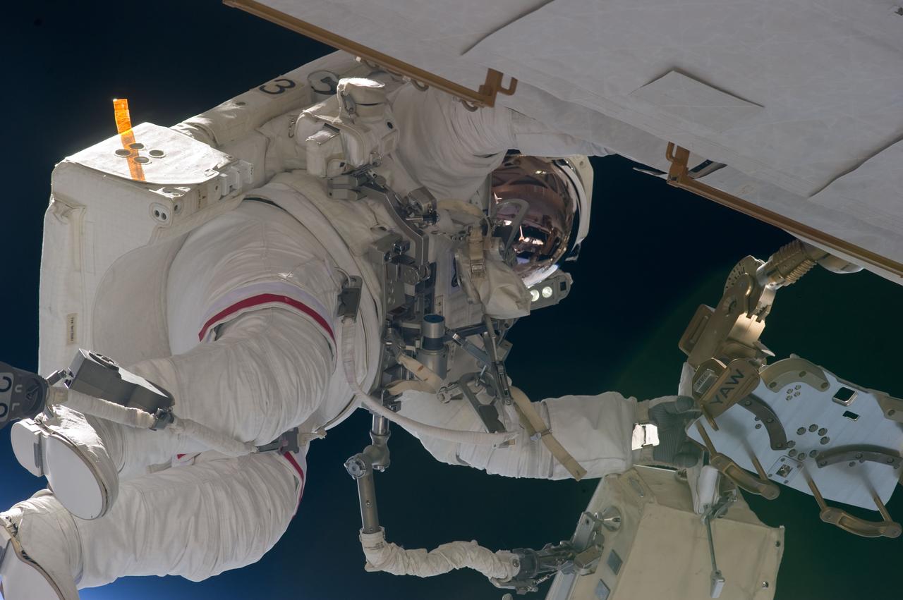 S134-E-008650 (22 May 2011) --- NASA astronaut Andrew Feustel, STS-134 mission specialist, participates in the mission's second session of extravehicular activity (EVA) as construction and maintenance continue on the International Space Station. During the eight-hour, seven-minute spacewalk, Feustel and astronaut Michael Fincke (out of frame), mission specialist, completed all planned tasks, including refilling one of the station’s cooling loops with ammonia and lubricating one of the station’s massive solar alpha rotary joints. Photo credit: NASA