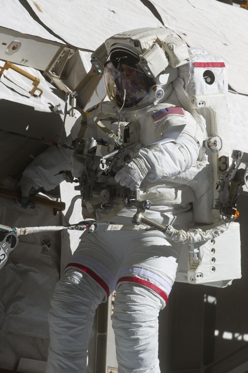 S134-E-009110 (25 May 2011) --- With various components of the International Space Station in the view, NASA astronaut Andrew Feustel is pictured during the STS-134 mission?s third spacewalk (Feustel?s third for the mission and sixth overall in his career). Astronauts Feustel and Michael Fincke (out of frame), both mission specialists, coordinated their shared activity with NASA astronaut Greg Chamitoff (out of frame), who stayed in communication with the pair and with Mission Control Center in Houston from the shirt sleeve environment inside the ISS. Photo credit: NASA