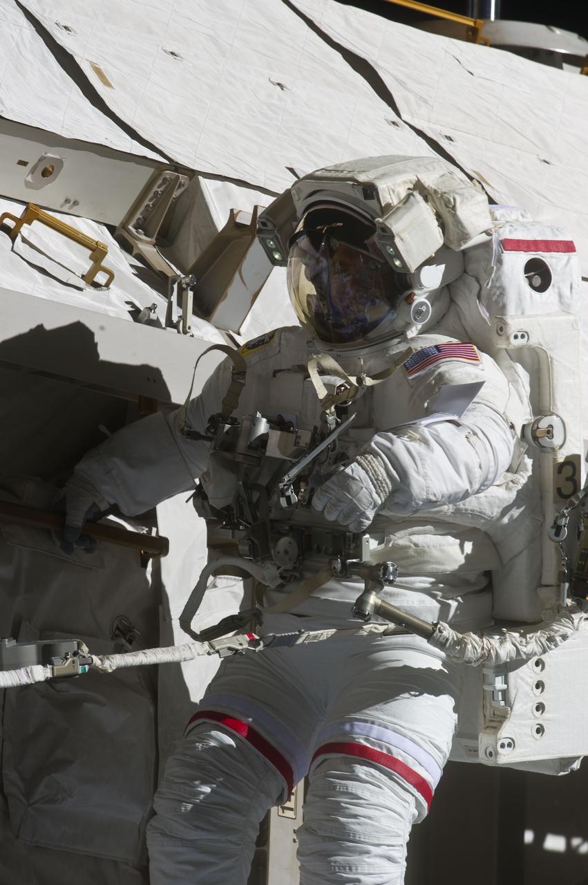 S134-E-009119 (25 May 2011) --- With various components of the International Space Station in the view, NASA astronaut Andrew Feustel is pictured during the STS-134 mission?s third spacewalk (Feustel?s third for the mission and sixth overall in his career). Astronauts Feustel and Michael Fincke (out of frame), both mission specialists, coordinated their shared activity with NASA astronaut Greg Chamitoff (out of frame), who stayed in communication with the pair and with Mission Control Center in Houston from the shirt sleeve environment inside the ISS. Photo credit: NASA