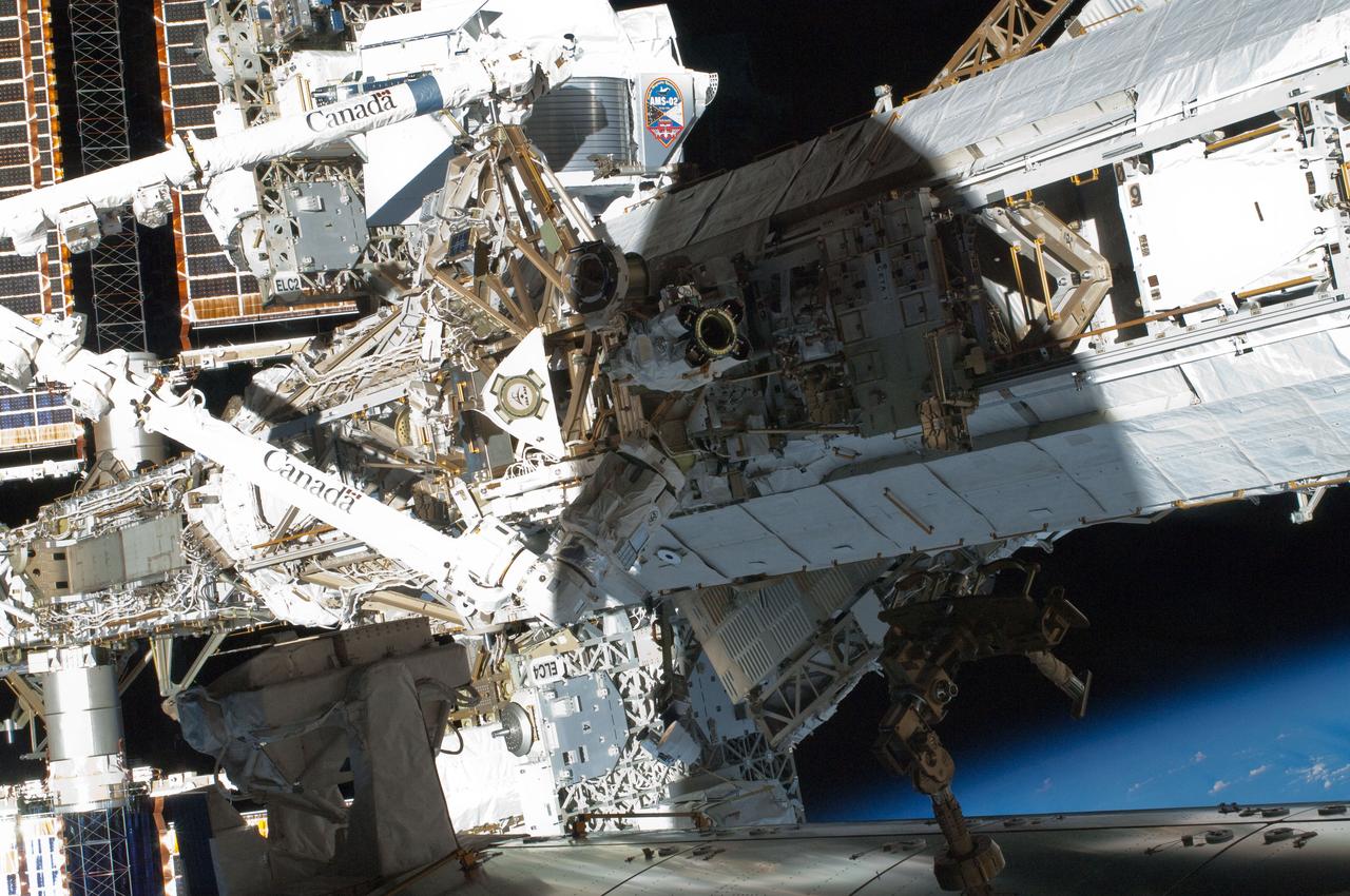 S134-E-009255 (19 May 2011) --- One of the STS-134 crew members recorded this high angle view of the starboard side truss segments on the International Space Station. The Alpha Magnetic Spectrometer (AMS-02) is being installed on the S3 truss segment next to the ExPRESS Logistics Carrier (ELC2). The AMS is still grappled by the Space Station Remote Manipulator System (Canadarm2), which is attached to the Mobile Transporter. Photo credit: NASA