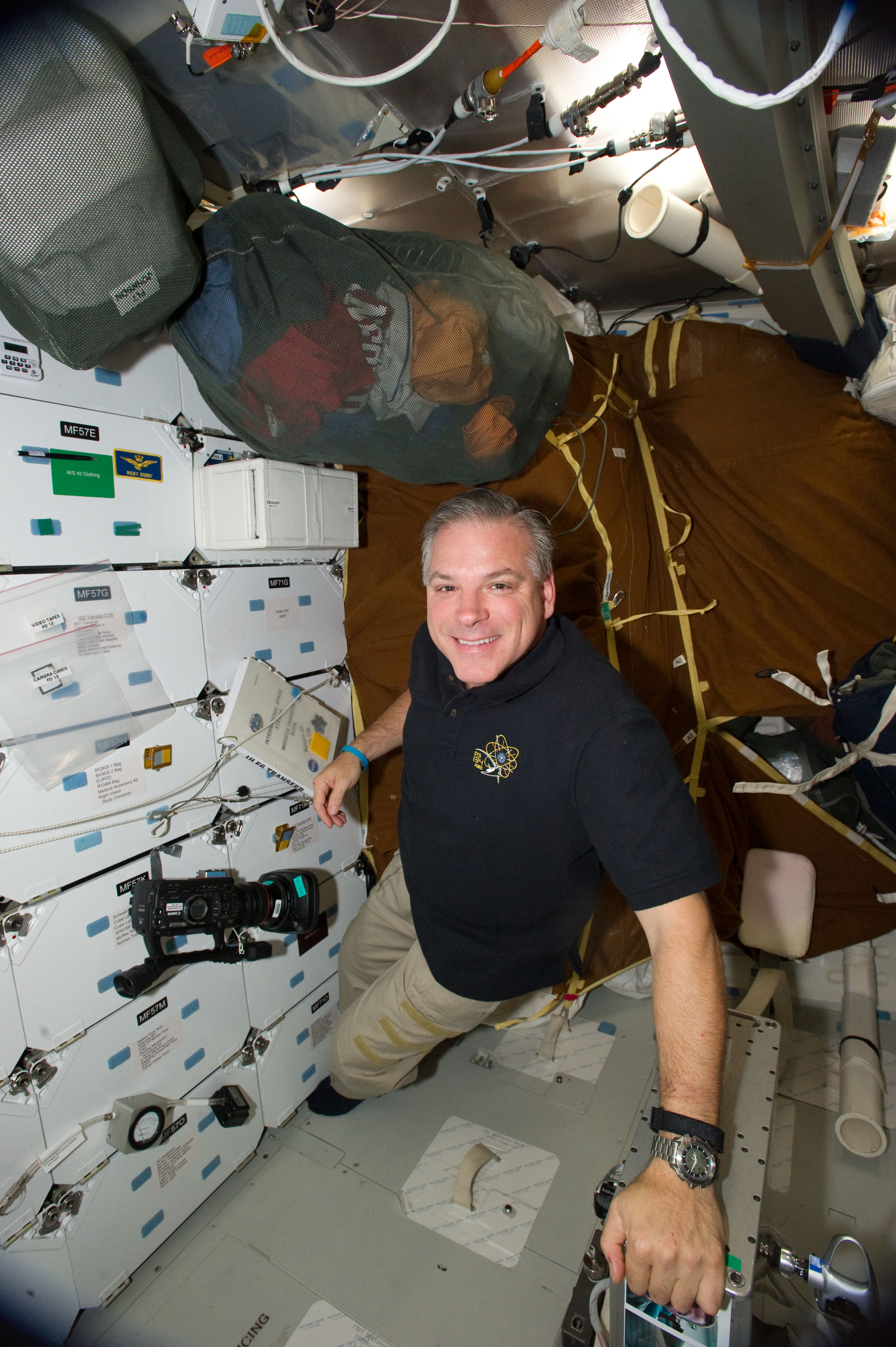 S134-E-011280 (28 May 2011) --- NASA astronaut Greg H. Johnson, STS-134 pilot, is pictured on the middeck of space shuttle Endeavour while docked with the International Space Station during flight day 13. Photo credit: NASA