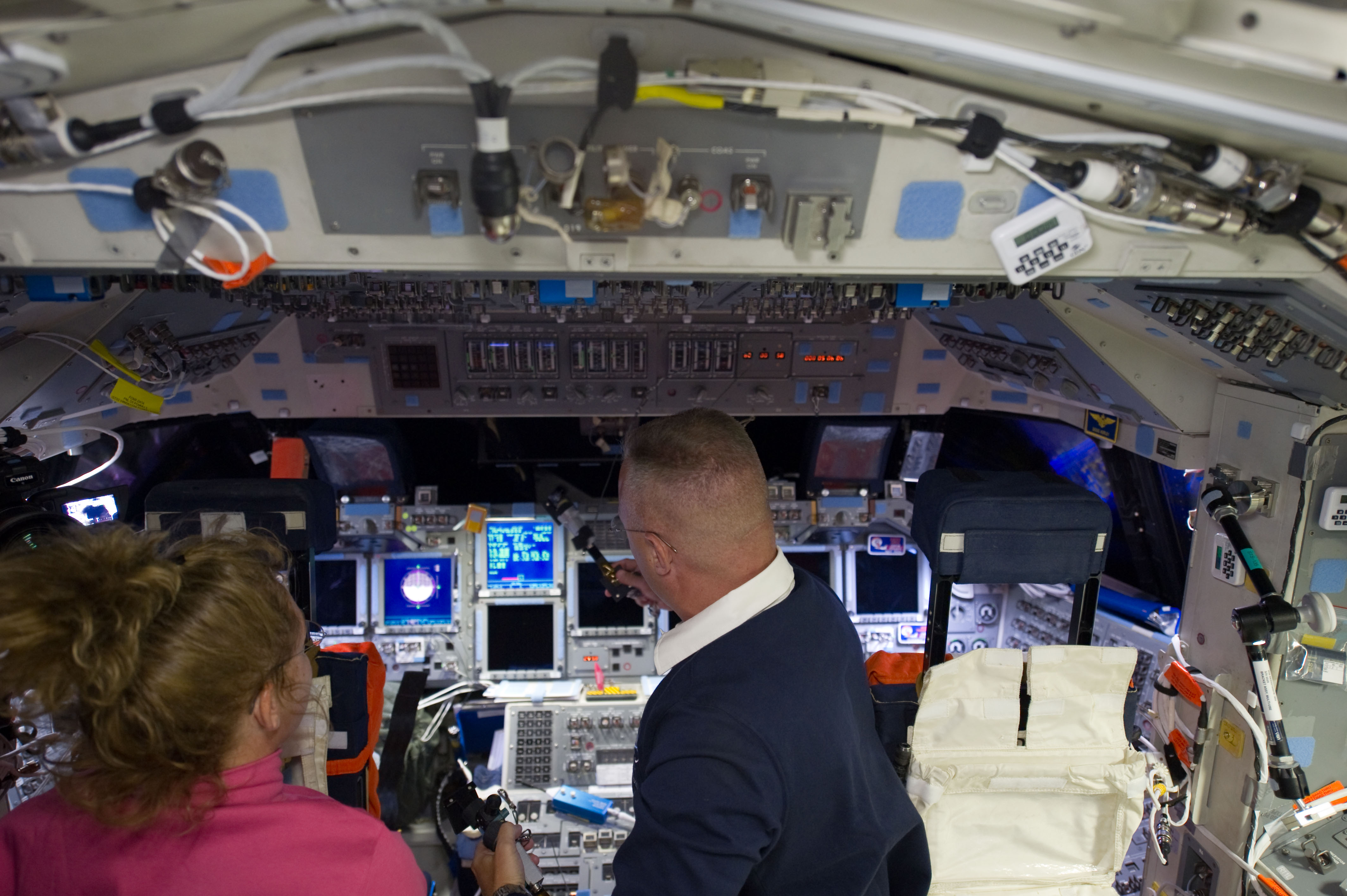 S135-E-006208 (8 July 2011) --- NASA astronauts Sandy Magnus, mission specialist, and Doug Hurley, pilot, are pictured on the flight deck of space shuttle Atlantis en route to the International Space Station. Magnus sat behind the commander and pilot for the launch phase of the Space Shuttle Program's final flight, and doubled as flight engineer. Photo credit: NASA