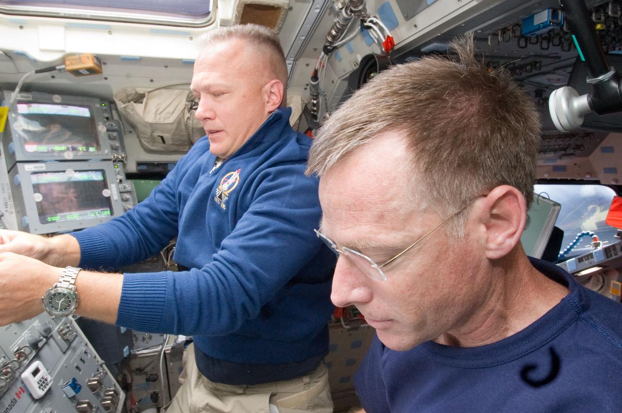 S135-E-006314 (9 July 2011) --- NASA astronauts Chris Ferguson (foreground), STS-135 commander, and Doug Hurley, pilot, are pictured on the aft flight deck of the space shuttle Atlantis during the mission's second day of activities in Earth orbit. Photo credit: NASA