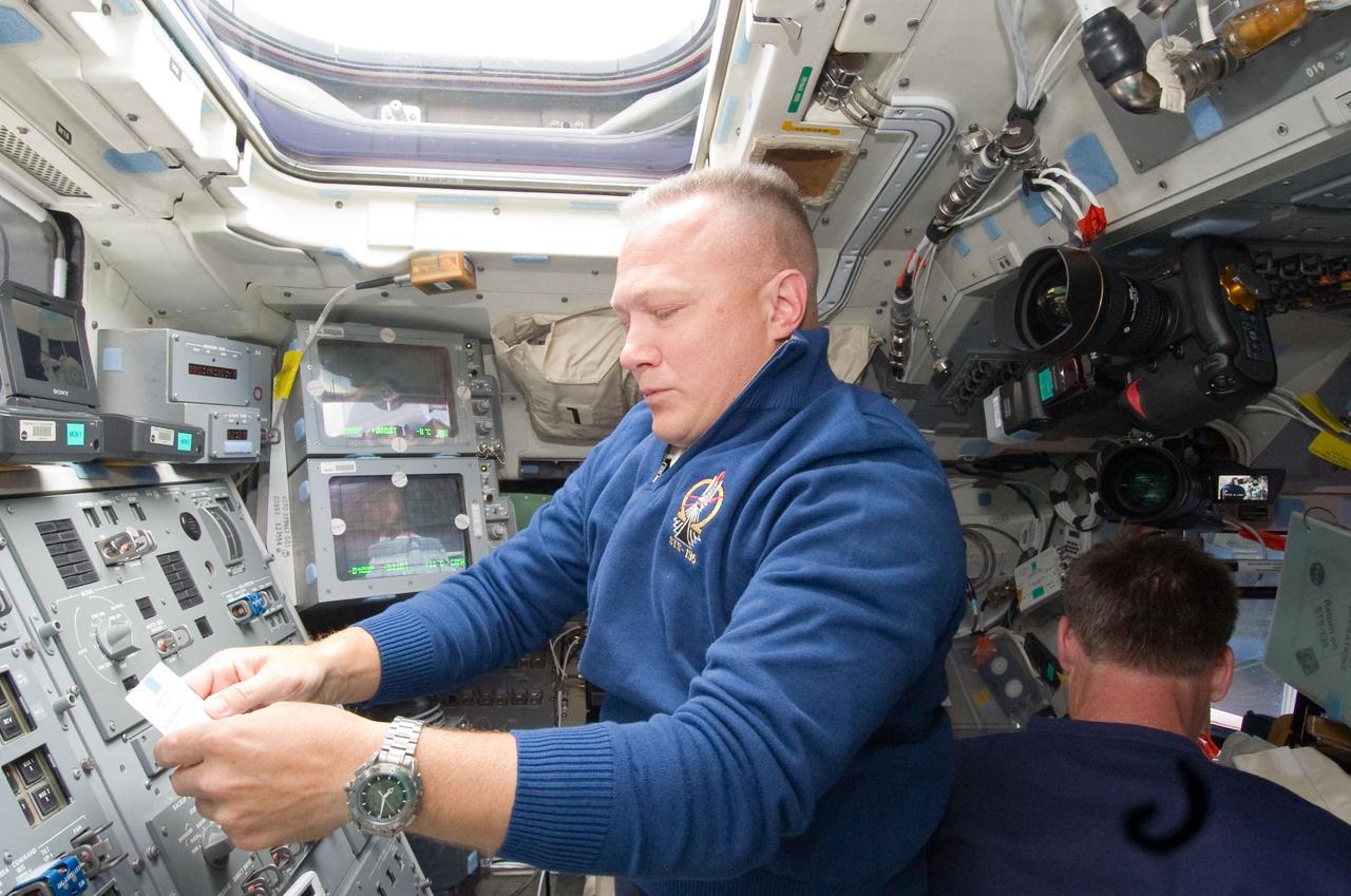 S135-E-006315 (9 July 2011) --- NASA astronaut Doug Hurley, STS-135 pilot, is pictured at controls on the aft flight deck of the space shuttle Atlantis during the flight's second day of activities in Earth orbit. NASA astronaut Chris Ferguson, mission commander, is at right. Photo credit: NASA