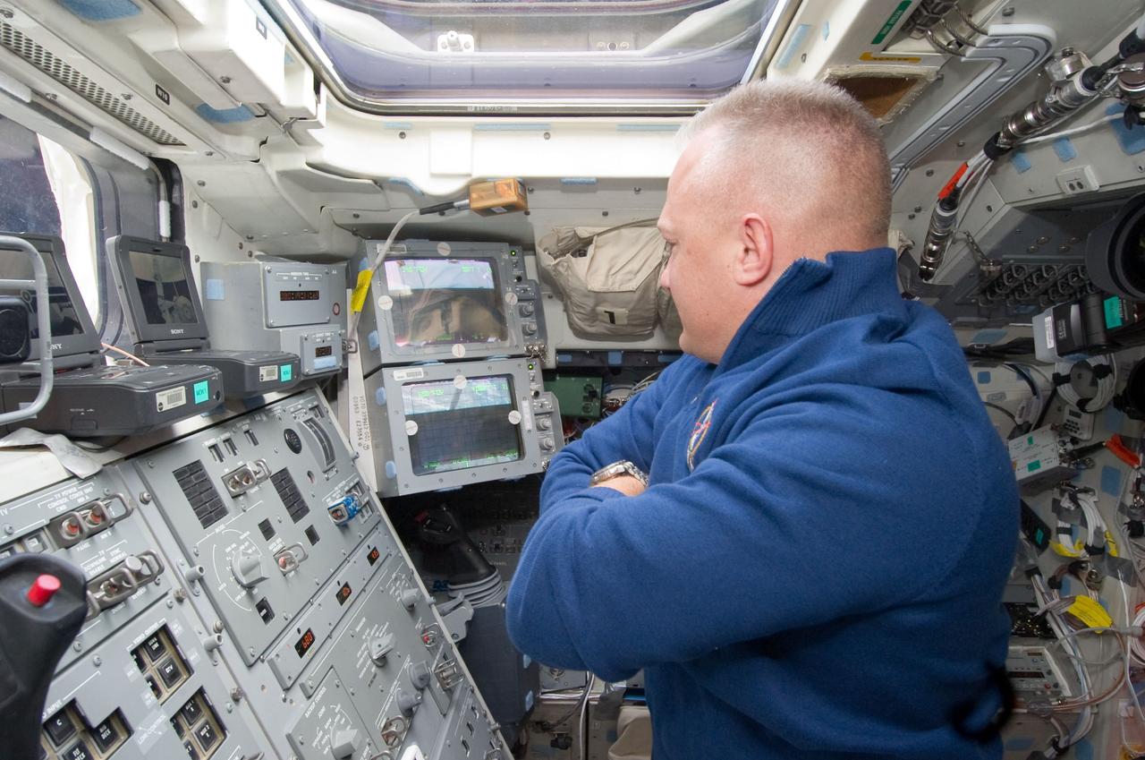 S135-E-006318 (9 July 2011) --- NASA astronaut Doug Hurley, STS-135 pilot, is pictured on the aft flight deck of the space shuttle Atlantis during the flight's second day of activities in Earth orbit. Photo credit: NASA