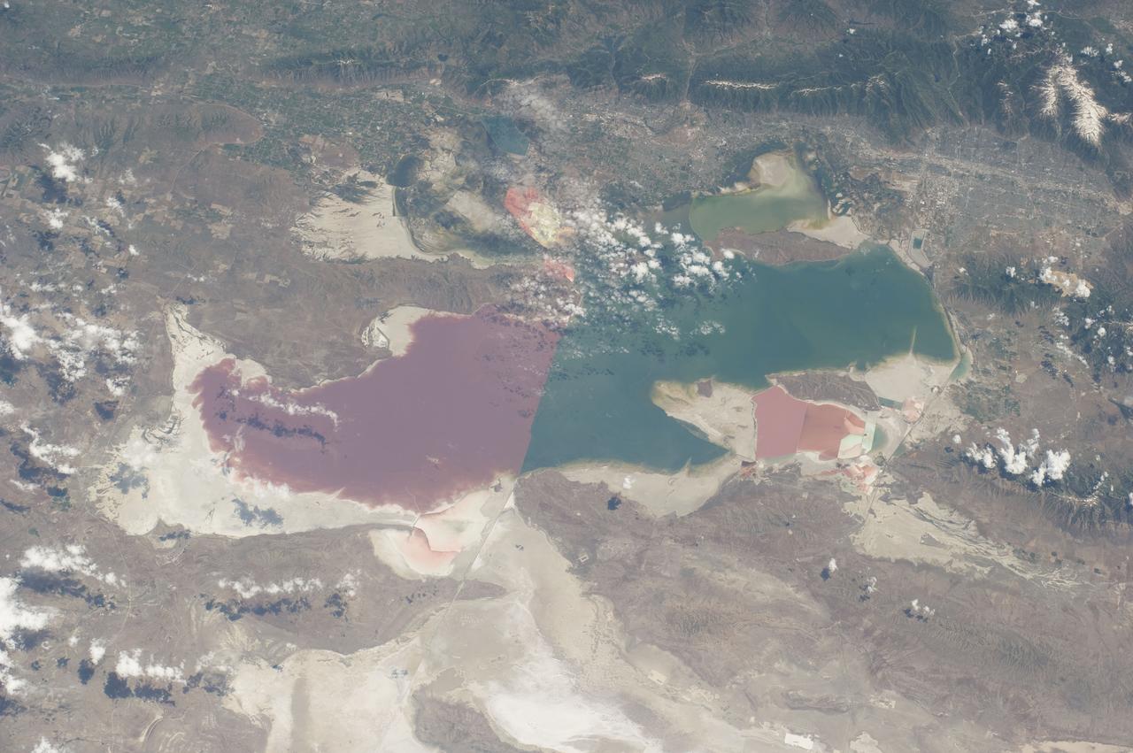 S135-E-006466 (9 July 2011) --- As in the case of many previous space missions, the Great Salt Lake in Utah serves as a striking visual marker for the STS-135 astronauts orbiting over North America in the space shuttle Atlantis. A sharp line across the lake's center is caused by the restriction in water flow from the railroad causeway. The eye-catching colors of the lake stem from the fact that Great Salt Lake is hypersaline, typically 3-5 times saltier than the ocean. Photo credit: NASA